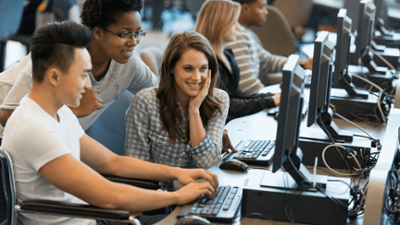 A row of students at computers 